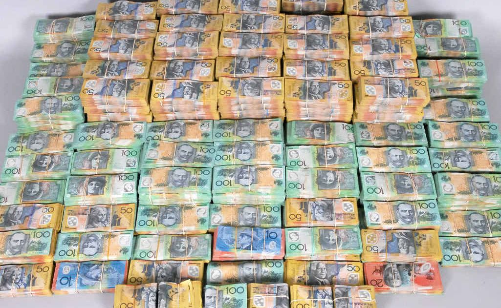 CASH HAUL: The roughly $3.5 million in cash police allegedly unearthed from co-ordinated raids in Bundaberg, Sydney and the Gold Coast. CASH HAUL: The roughly $3.5 million in cash police allegedly unearthed from co-ordinated raids in Bundaberg, Sydney and the Gold Coast.